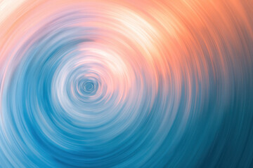 Swirling background of peach colour graduating in circular motion into light blue texture