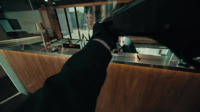 POV gun view of a bank robbery