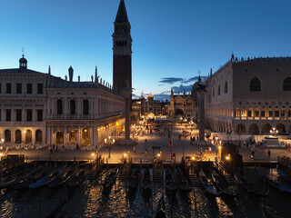 Fototapeta na wymiar Venice panoramic cityscape landmark at sunset or night, aerial view of Piazza San Marco