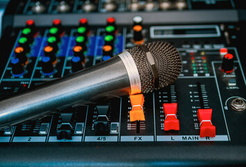 Close-up  microphone on sound mixer in live broadcasting studio producer for sound record control...