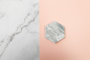 Top view of marble tray on pink and white marble background. Creative product presentation flat lay. Copy space.
