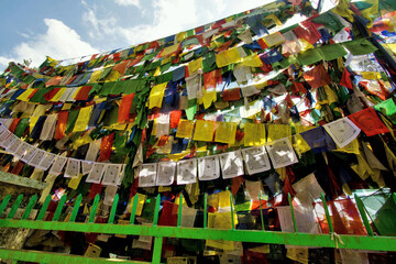 Prayer flags outside Drikung Kagyu Gompa Buddhist Monastery, Rewalsar, Nagar, Mandi, Himachal Pradesh, India, Asia - obrazy, fototapety, plakaty