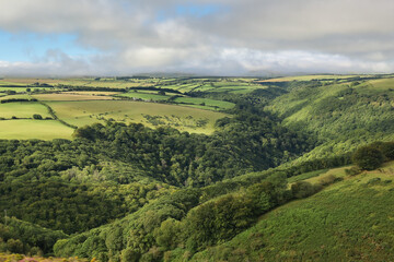 Fototapeta na wymiar Top view of meadows and woodlands in Exmoor National Park, England 