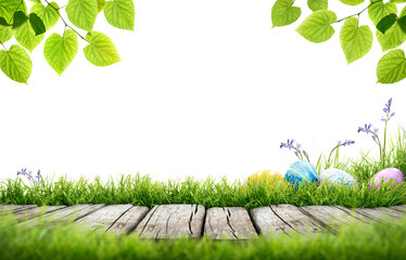 A line of painted easter eggs in the grass celebrating a Happy Easter with a wooden bench to place products on with green grass and tree leaves on a transparent background