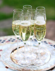 Champagne glasses on silver tray