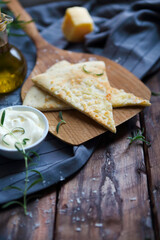 Focaccia with olive oil, parmesan cheese, white sause and rosemary