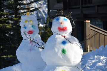 Snowman couple by winter 