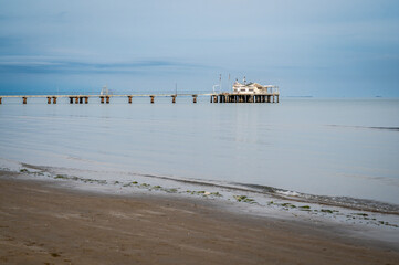 Lignano Pineta. the pier overlooking the sea and its spiral shape. - 712327825