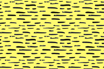 Thin horizontal lines pattern on yellow background. Hand drawn small black dash seamless texture. Black linear ornament. Memphis style background with brush stripes. Abstract modern vector texture.