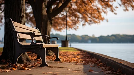 Foto op Plexiglas Bench in the park near the lake shore. The fall season, fallen leaves. Generative ai © nilanka