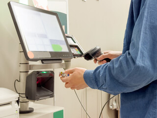 Customer pays his purchase at the supermarket,self checkout systems in  retail stores,Barcode...