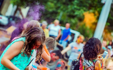 People throwing colors at Holi festival