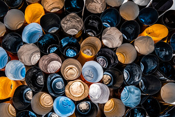 Aluminum and plastic wine bottle caps from different wine producing brands