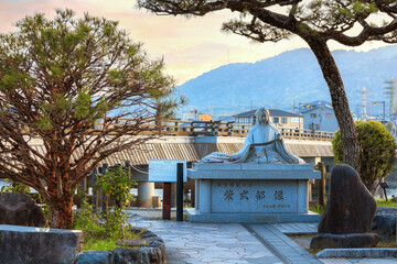 Kyoto, Japan - April 1 2023: Murasaki Shikibu statue at the Uji riverside, a Japanese novelist,...