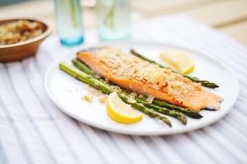 baked salmon with crispy skin served with asparagus