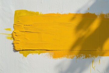 A vivid yellow paint stroke creates a striking rectangular shape on a white background, providing an ideal space for custom messages or text in ads, promotions, or artistic displays.