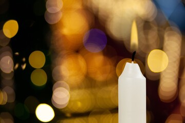 Light candle burn on background with lights