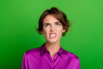 Photo of mad furious girl dressed trendy magenta clothes showing teeth look up empty space isolated...