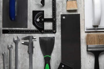 Set of construction tools on grey background