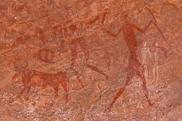 Rock art, petroglyph from the Neolithic period, depictions of human figures, Bouhadian rocks in Tadrart Rouge, Tassili N'Ajjer National Park. Sahara, Algeria, Africa. 