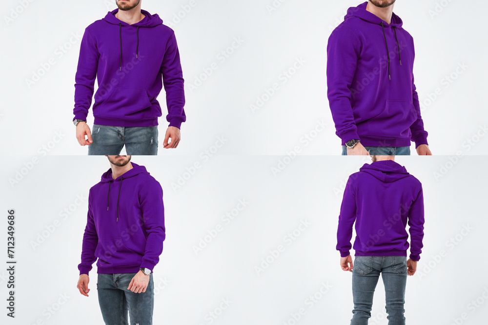 Canvas Prints a young man with a beard models a colorful hoodie in a studio. the sweatshirt is a blank template fo - Canvas Prints