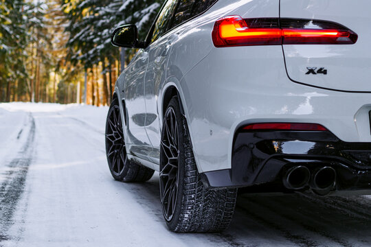 car in snow BMW X4 M white