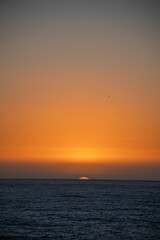 beautiful golden hour sunset in the pacific ocean on the chile coast south america portrait