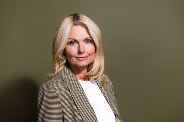 Portrait of serious blonde hair business lady financial independent alone woman happy mother...