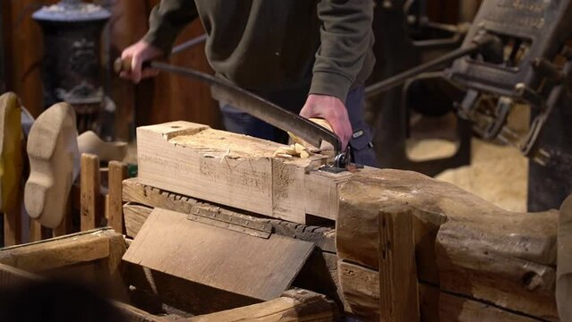Man making wooden shoes (dutch: klompen), Netherlands