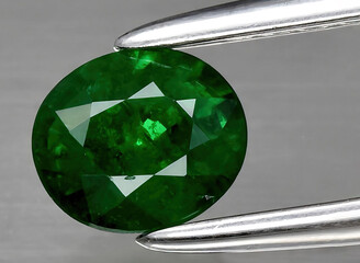 natural green tsavorite garnet gem on the background