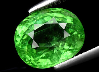 natural green tsavorite garnet gem on the background