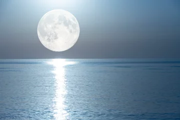 Wall murals Reflection Full moon with a lunar path reflected in the mirror of the sea.
