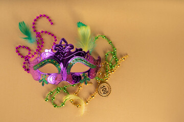 Mardi Gras colorful holiday greeting card background with festival masquerade accessories, decor,...
