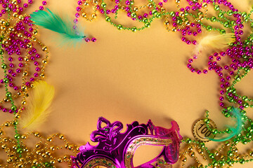 Mardi Gras colorful holiday greeting card background with festival masquerade accessories, decor,...