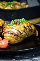 Hasselback potatoes with meat and herbs