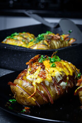 Hasselback potatoes with meat and herbs