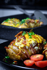 Hasselback potatoes with meat and herbs