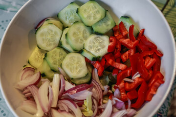 Vegetable salad in white bowl.