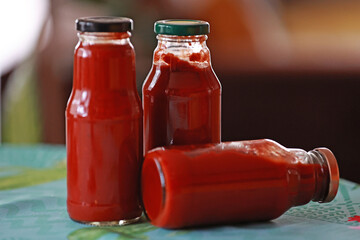Fresh tomato juice in bottles.