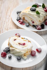 Meringue roll with wild berries
