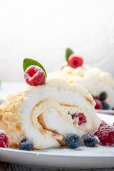 Meringue roll with wild berries