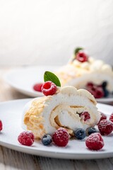 Meringue roll with wild berries