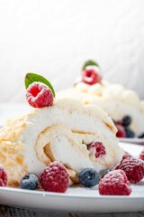 Meringue roll with wild berries