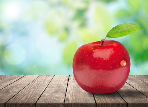 Tasty fresh ripe apple on the desk