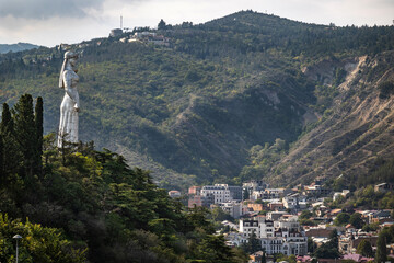 View of Mother Kartli. The monumental statue in Tbilisi is one of the symbols of the city. At the foot of the statue are the old houses of Tiflis.