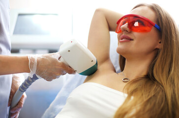 Woman on procedure of laser epilation