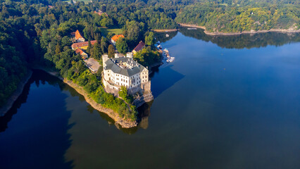 Aerial view of Orlik castle over Orlik reservoir. Beautiful gothic landmark over the lake. Orlik...