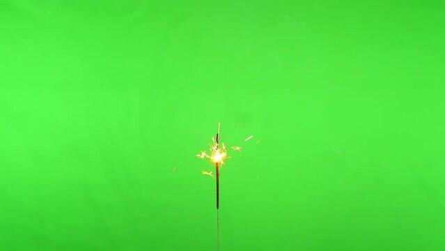 Close up sparkler fireworks on green screen background for celebrating