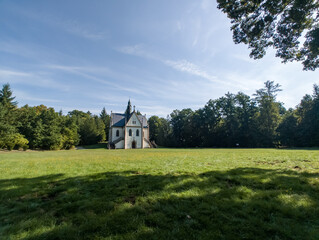 Curch near Orlik castle over Orlik reservoir. Beautiful gothic landmark over the lake. Orlik nad...