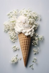 Ice cream of gypsophila flowers in waffle cone on light gray table top view in flat lay style.
